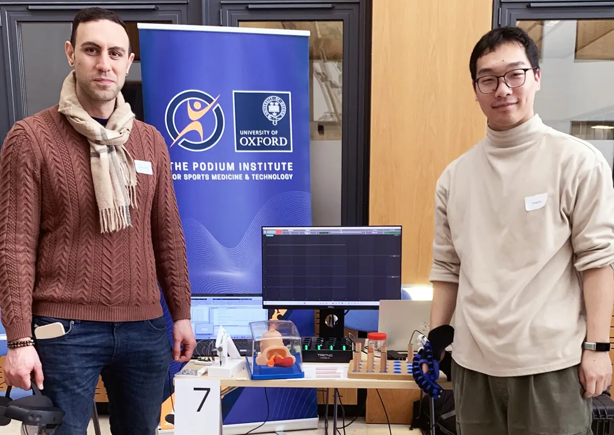 Postdoctoral Researcher Dr Ryman Hashem and doctoral student Yixing Lei from the Podium Institute for Sports Medicine and Technology, preparing their demonstration on “Soft Robotics and Augmented Reality for Rehabilitation”.