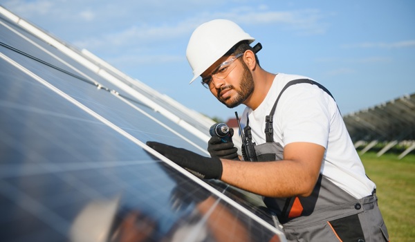 Engineer installing solar panels